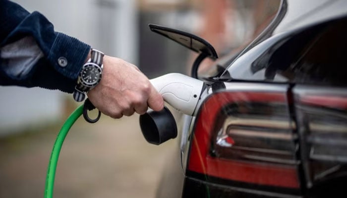 **UK’s Electric Vehicle Boom Sparks Controversy Over Petrol and Diesel Car Ban**